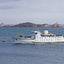 Photo from Friendly Guides Isles of Scilly Guidebook showing the Scillonian III steaming in front of Little Ganinick (Eastern Isles)