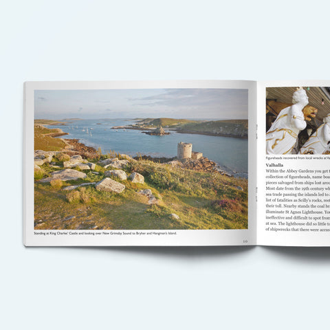 Pages from our Scilly Island by Island book on Tresco looking from King Charles' Castle over Cromwell's Castle towards Bryher. The facing page shows a figureheads from wrecked ships on display at Valhalla Musueum in the Abbey Gardens.