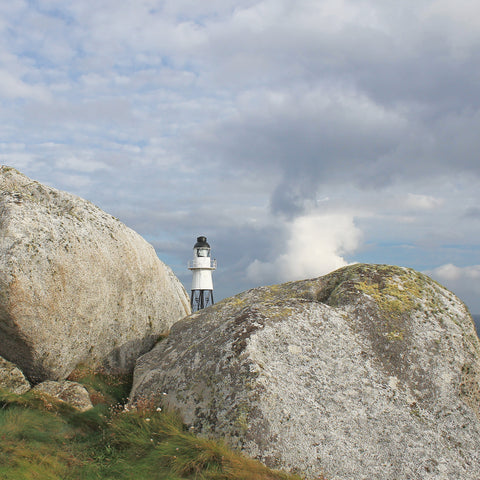 Photo from Friendly Guides Isles of Scilly Guidebook showing Peninnis Head Lighthouse on St Mary's, Isles of Scilly