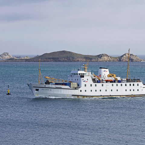 Photo from Friendly Guides Isles of Scilly Guidebook showing the Scillonian III steaming in front of Little Ganinick (Eastern Isles)